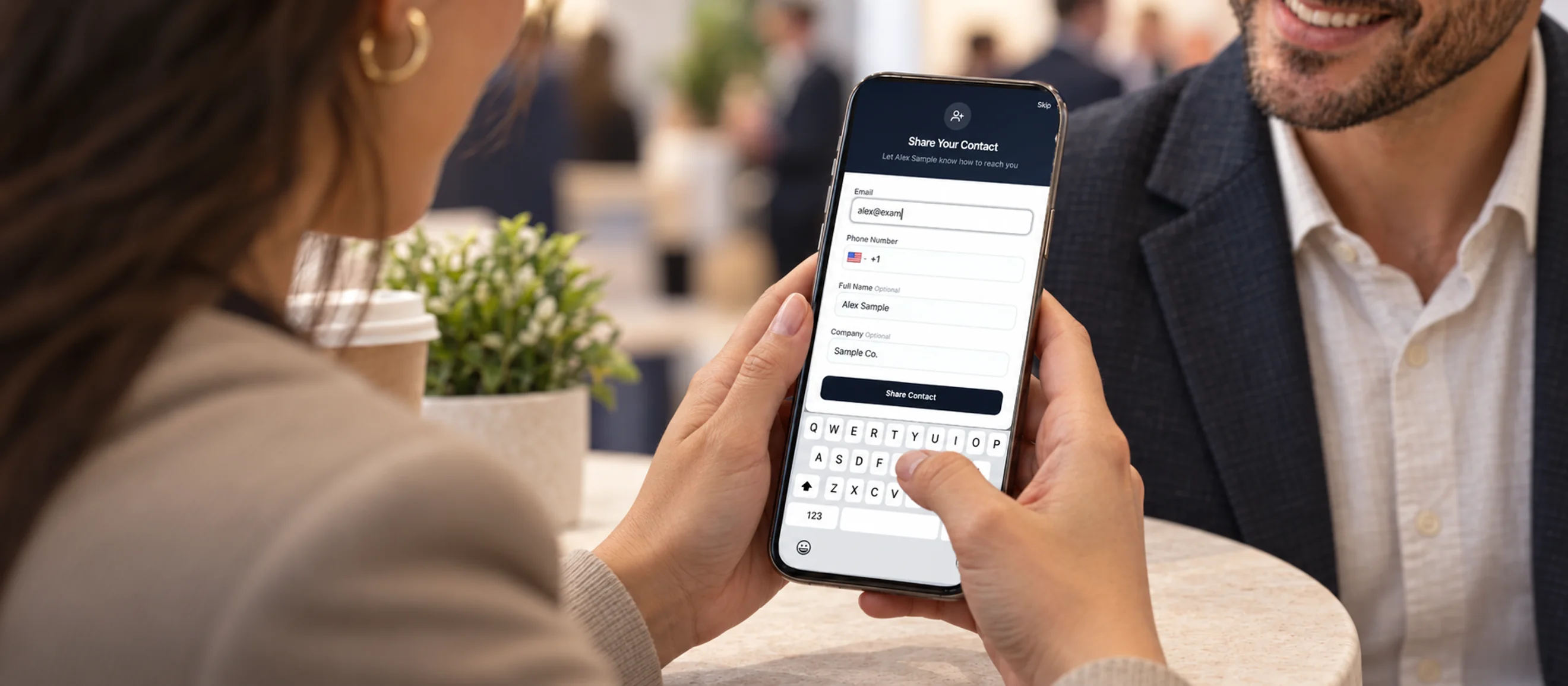 A visitor typing their contact details into the short form on a digital business card, on their own phone.