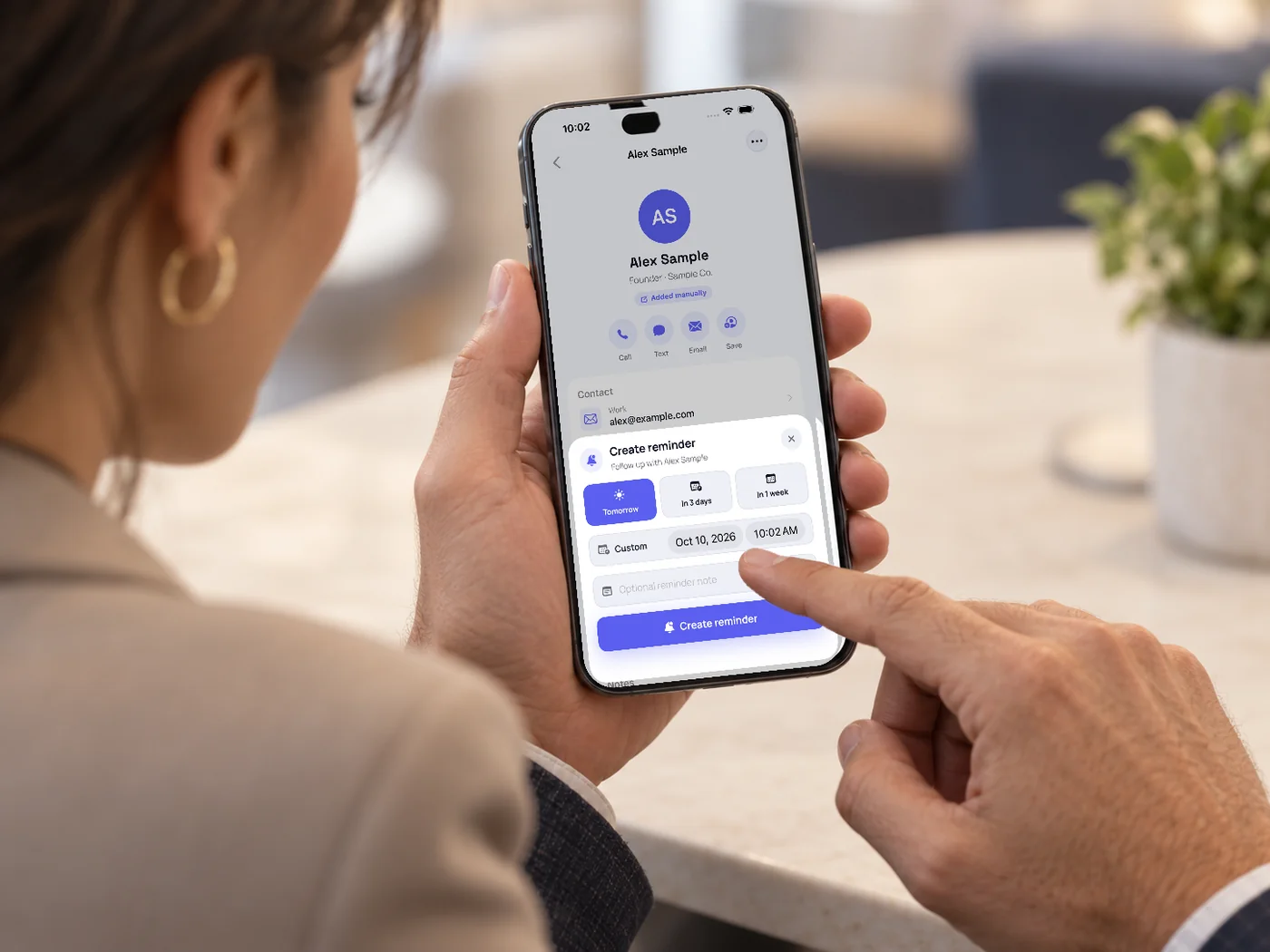 Setting a follow-up reminder for a contact in the mobile app.