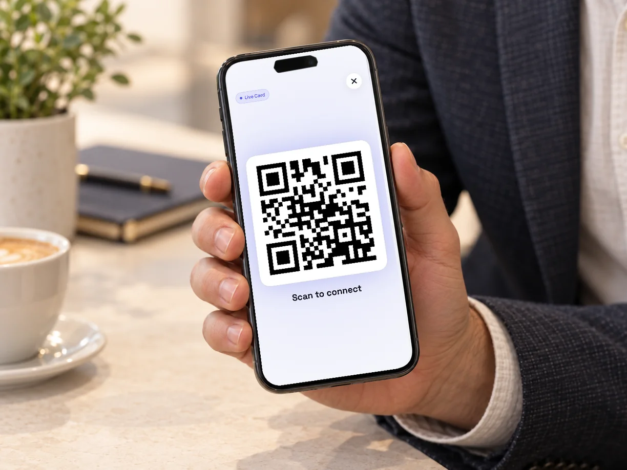 Showing the QR code of a digital business card on a phone.